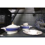 Cage containing tureens and china