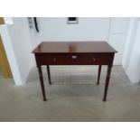 A Victorian mahogany and strung single drawer writing table on turned supports