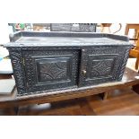 Carved oak table top double door cupboard