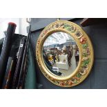 Circular convex mirror in floral frame