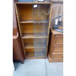 Beech bookcase with glazed sliding doors