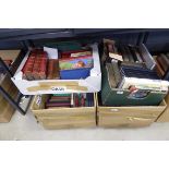 Underbay with 4 boxes containing a large quantity of reference books and novels