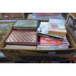 Box containing Readers Digest magazines and books