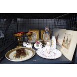 Cage containing Bohemian glasses, piano baby, carved wooden candlesticks, posies, prints of roses,