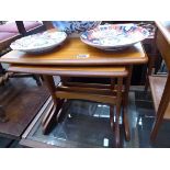 Teak nest of three tables plus lamp table with single drawer and shelf under