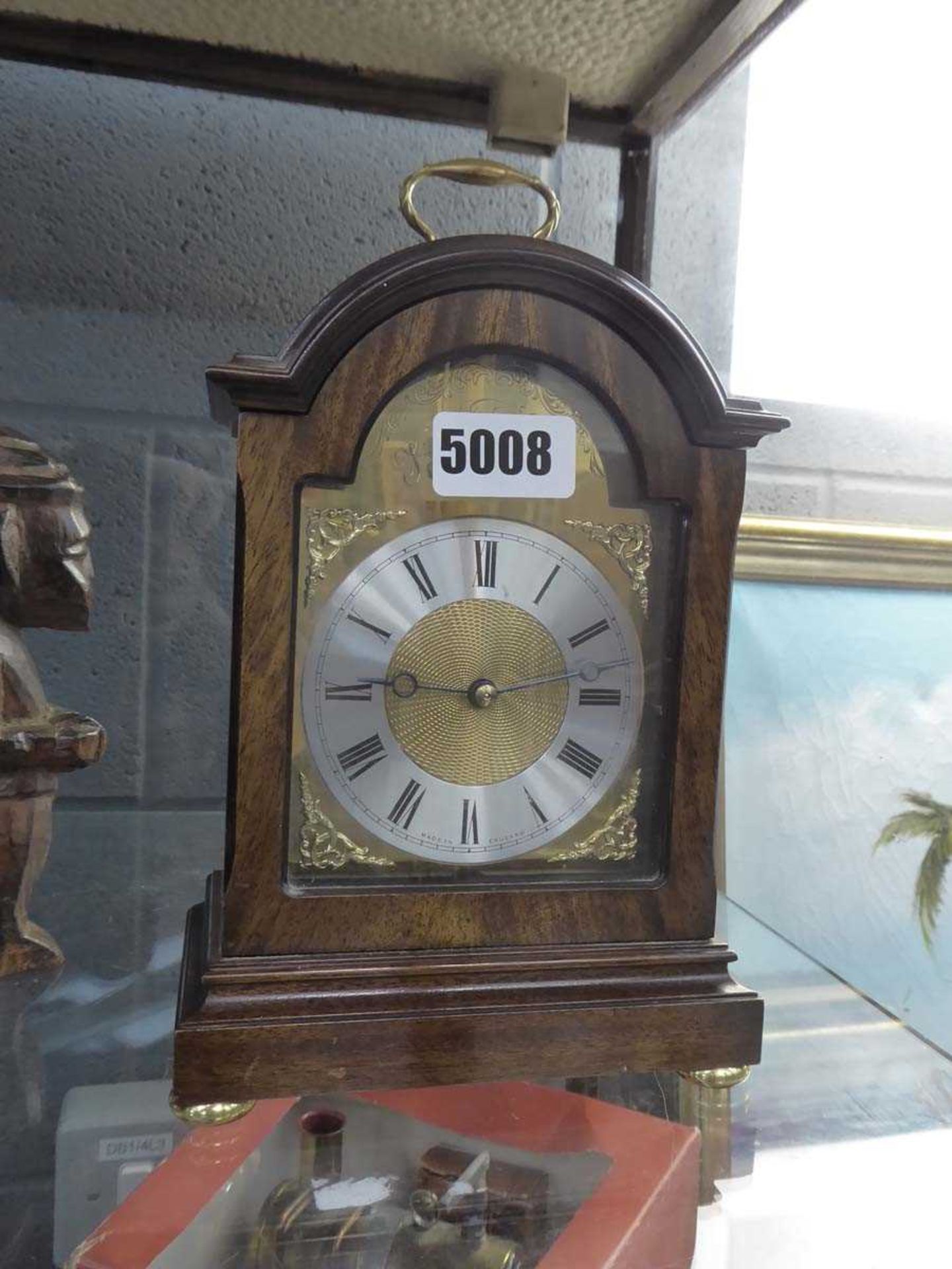 Domed topped mantel clock in walnut case