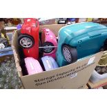 Box containing Barbie cars