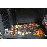 Cage containing costume jewellery, photographs, ornamental figures and a napkin ring