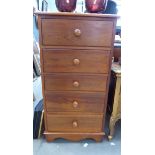 Narrow pine chest of 5 drawers