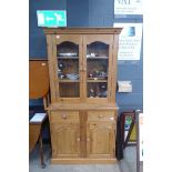 Glazed pine china cabinet with cupboard base under