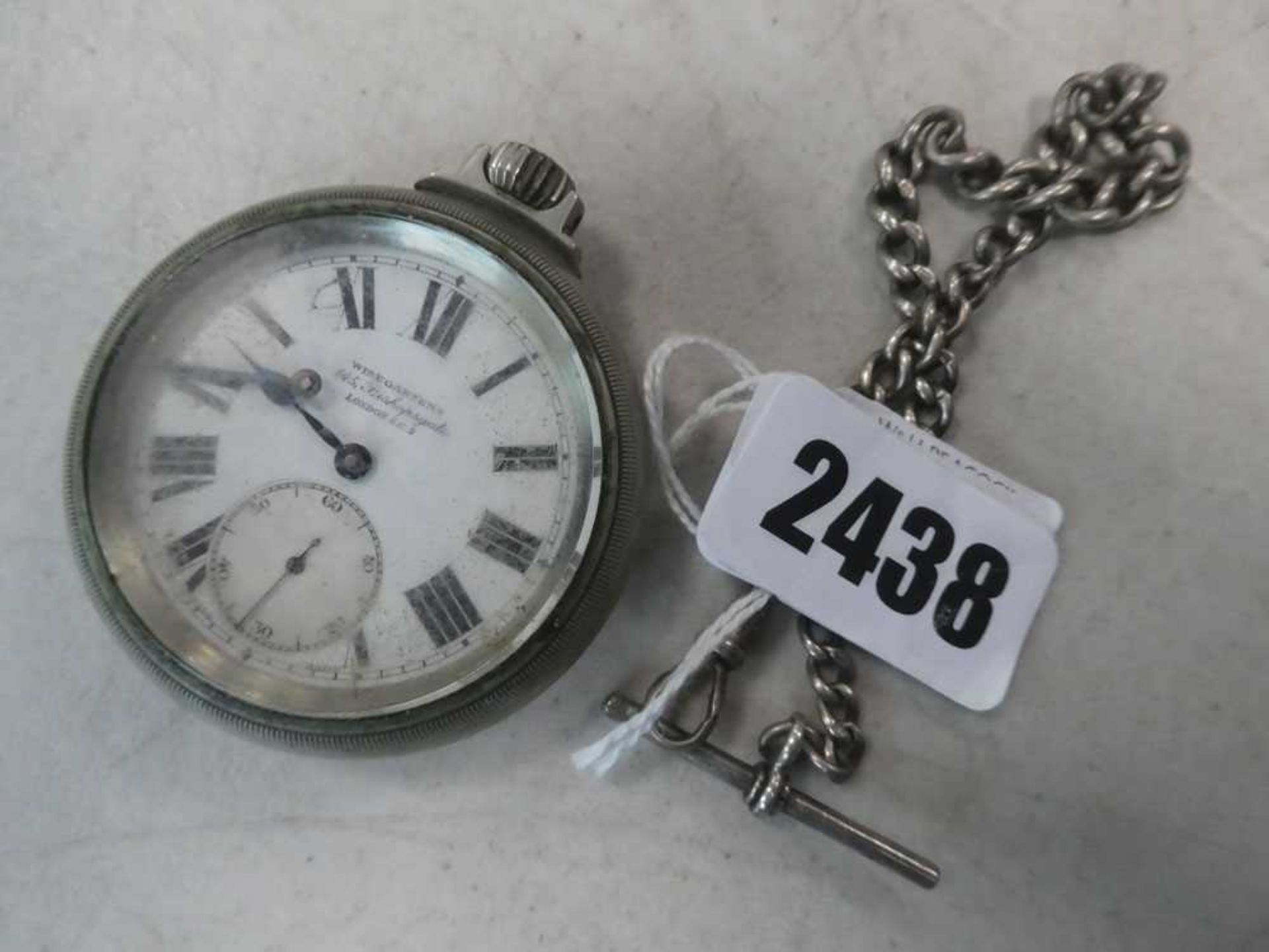 A base metal open face Railway Regulator pocket watch by Winegarten's, the white enamel dial with