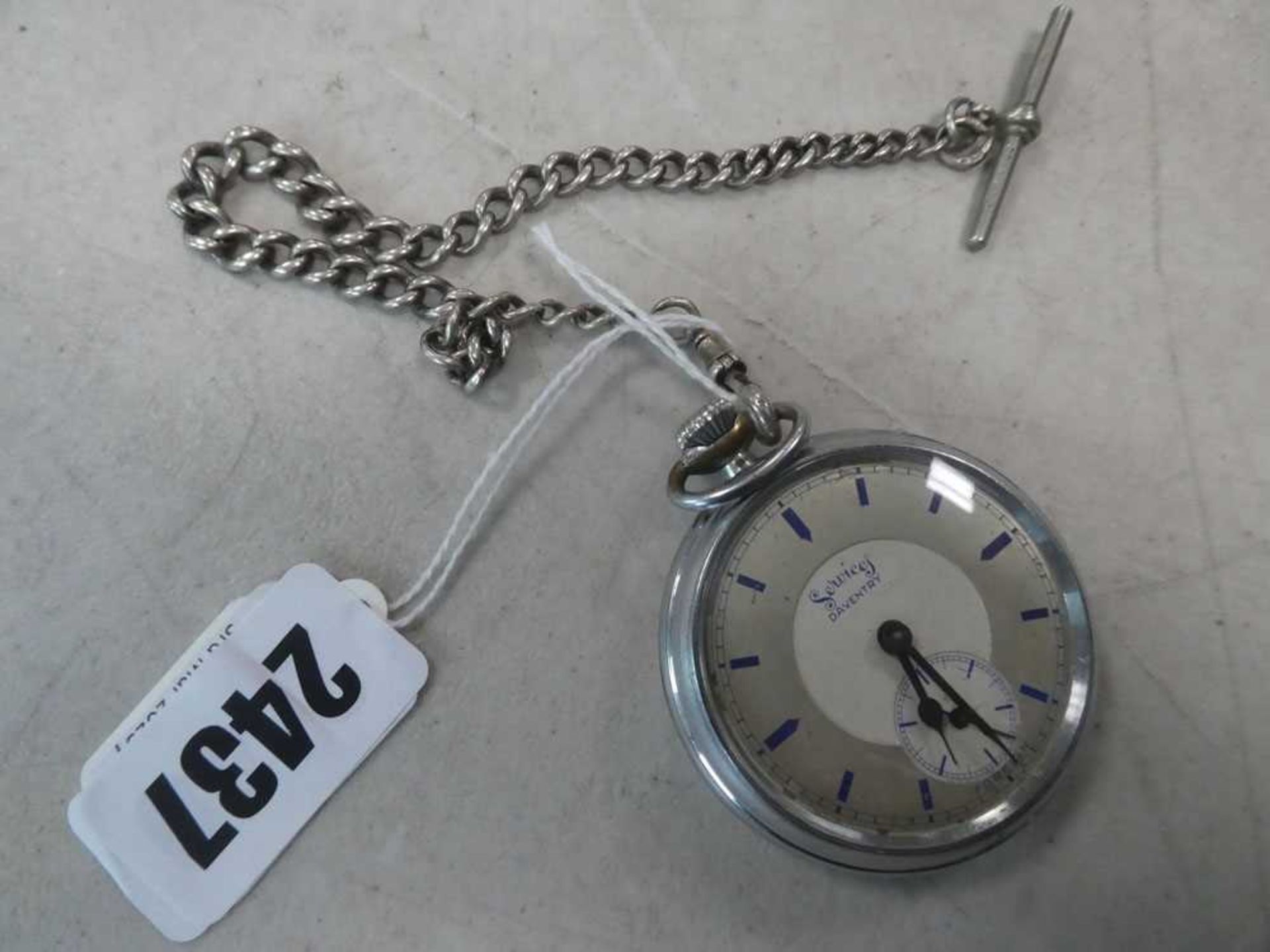 A stainless steel open face pocket watch by Services, the dial with blue baton numerals and second