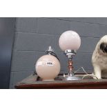 Pair of chrome and glass table lamps with globe shaped shades