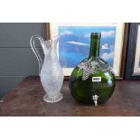 Etched water jug plus a wine bottle with tap