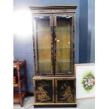 Ebonised Chinese two door display cabinet with cupboard under