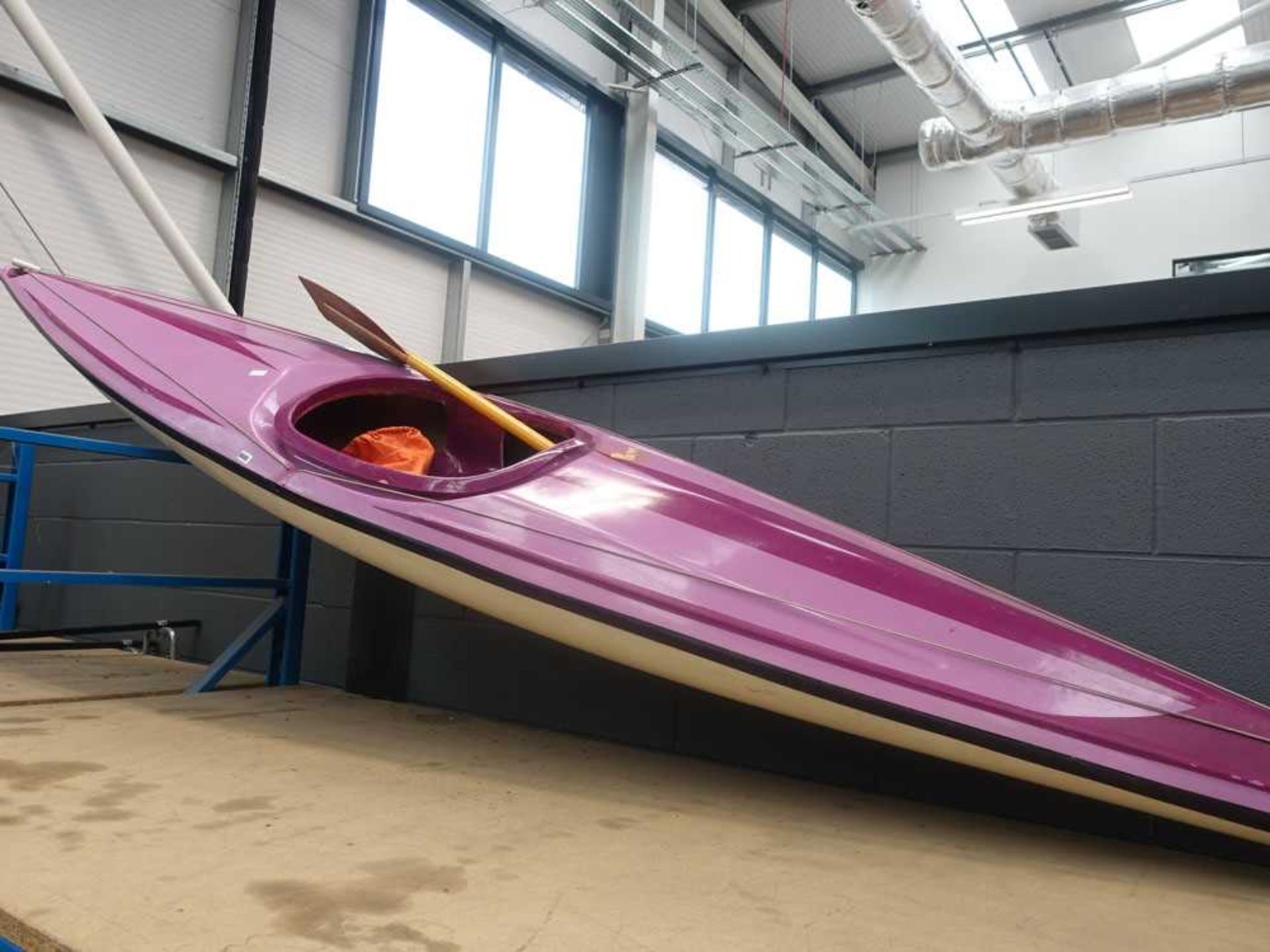 Fibreglass canoe with paddle