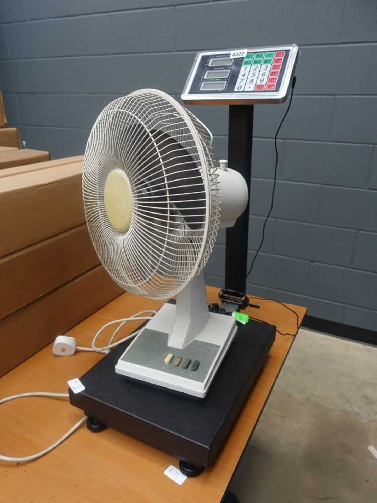 Pair of weighing scales and a desk fan