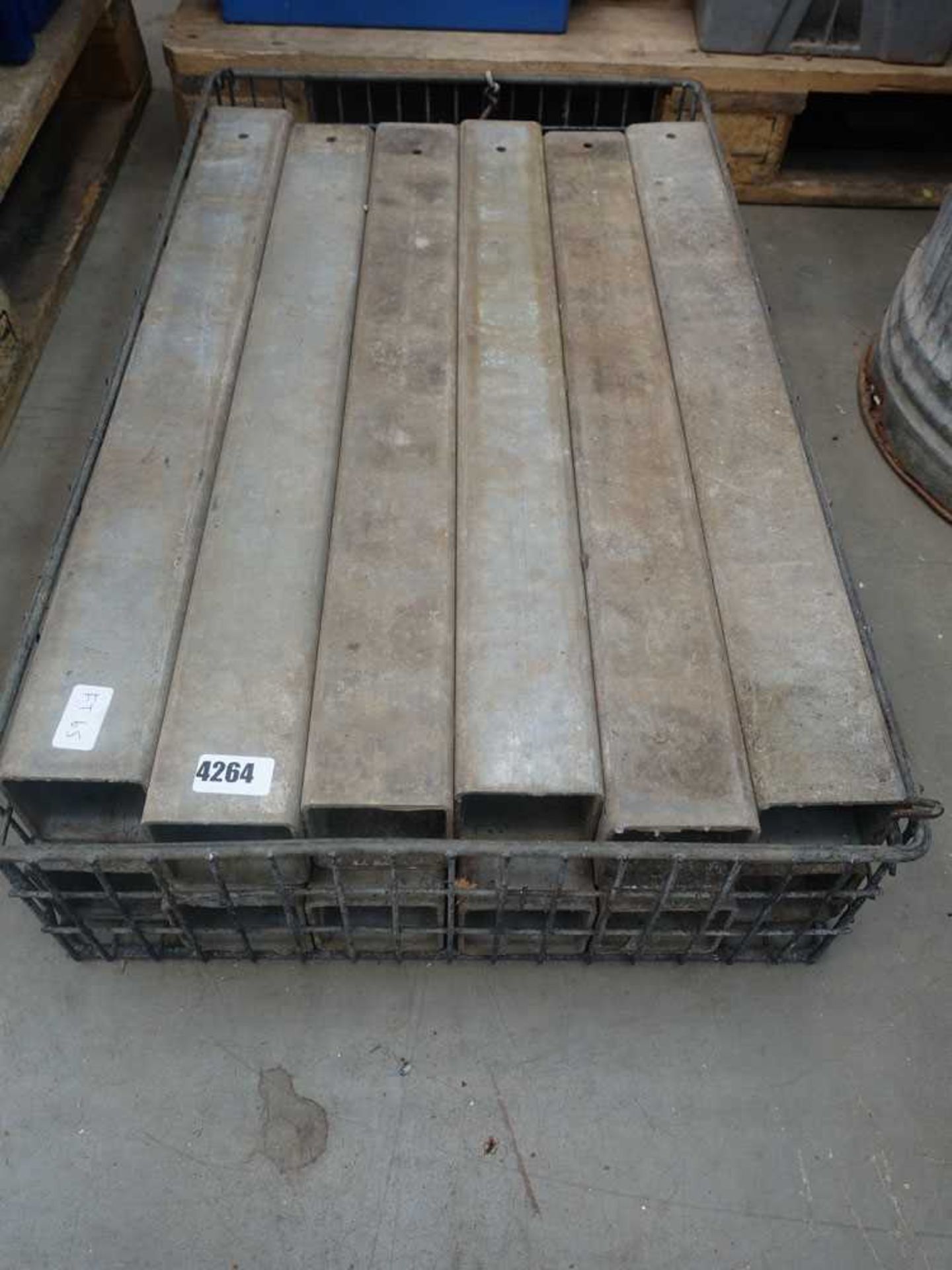 Small wire cage of metal galvanised post sleeves
