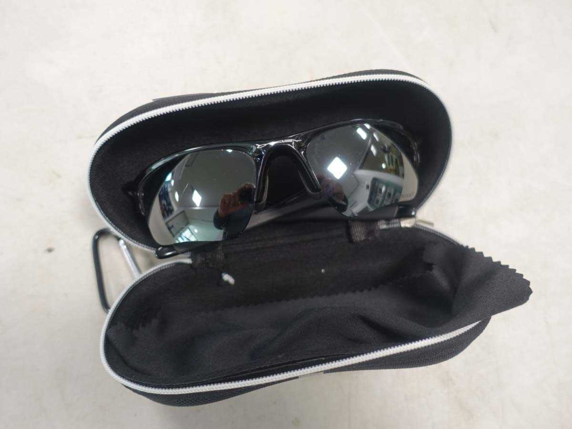 Pair of Oakley sunglasses in case