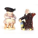 A toby jug modelled as a rotund gentleman, h. 24 cm and another modelled as a seated gentleman