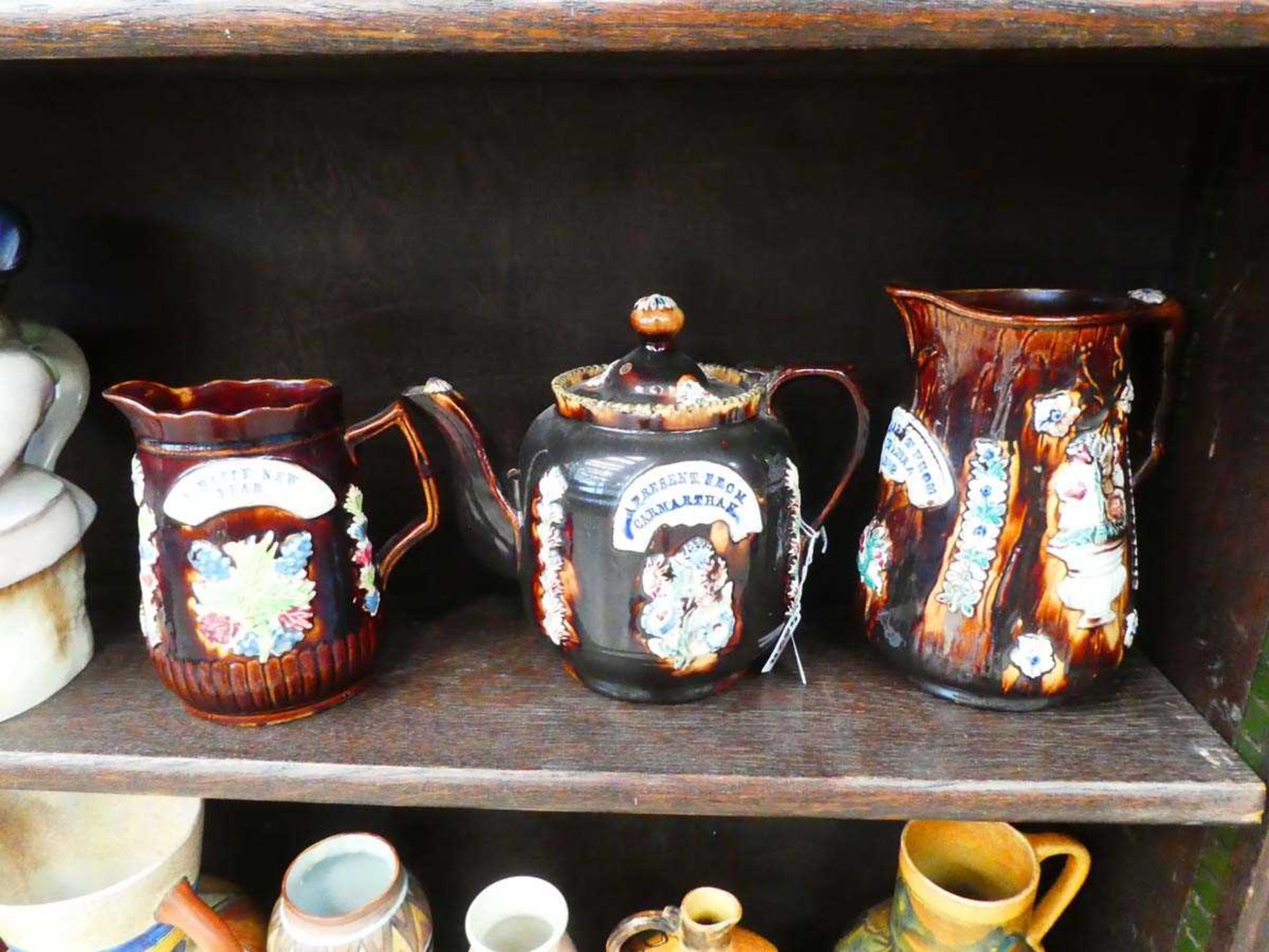 A bargeware teapot, typically decorated 'A Present from Carmarthan', h. 19 cm and similar two - Image 2 of 2