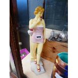 Resin figure of young lady on phone