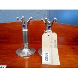 Pair of white metal candlesticks