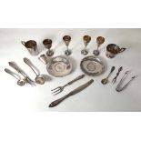 A group of Latvian silver comprising two pin dishes, two cups, five (?)communion cups, a pair of