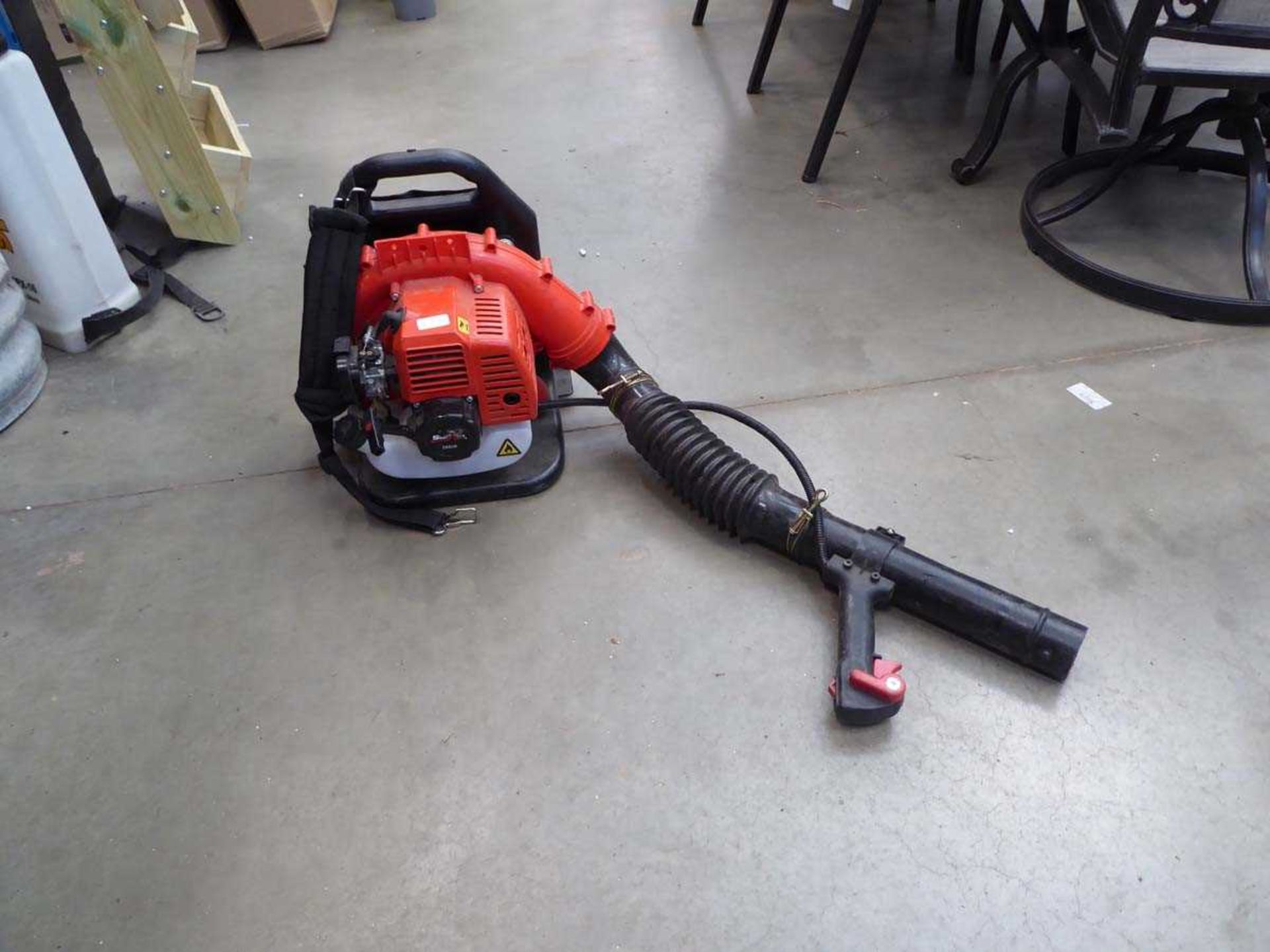 Red petrol powered leaf blower