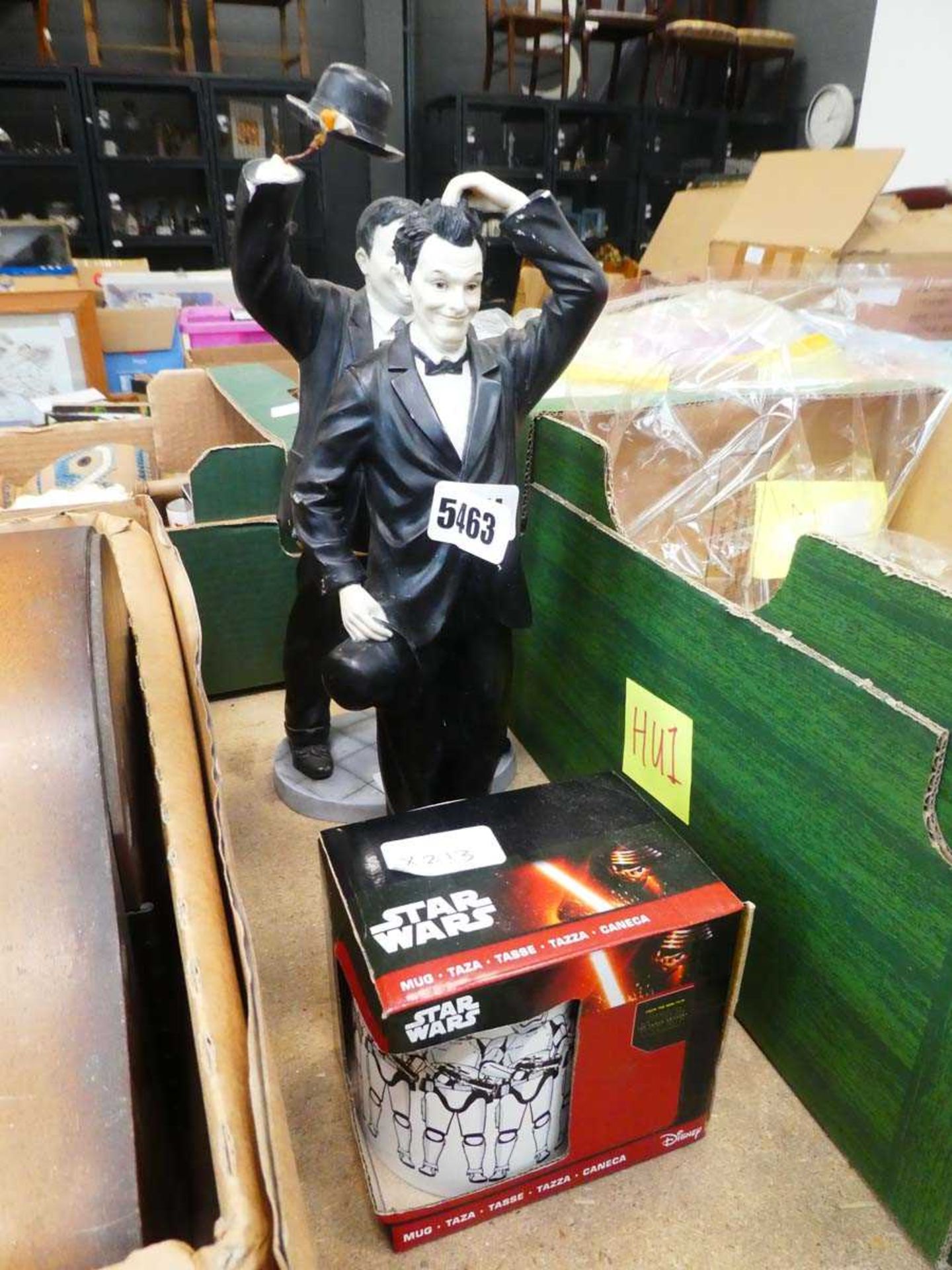 Two resin figures of Laurel and Hardy and a Star Wars mug