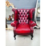 Oxblood wingback button back armchair