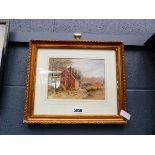 Framed picture of a countryside house scene