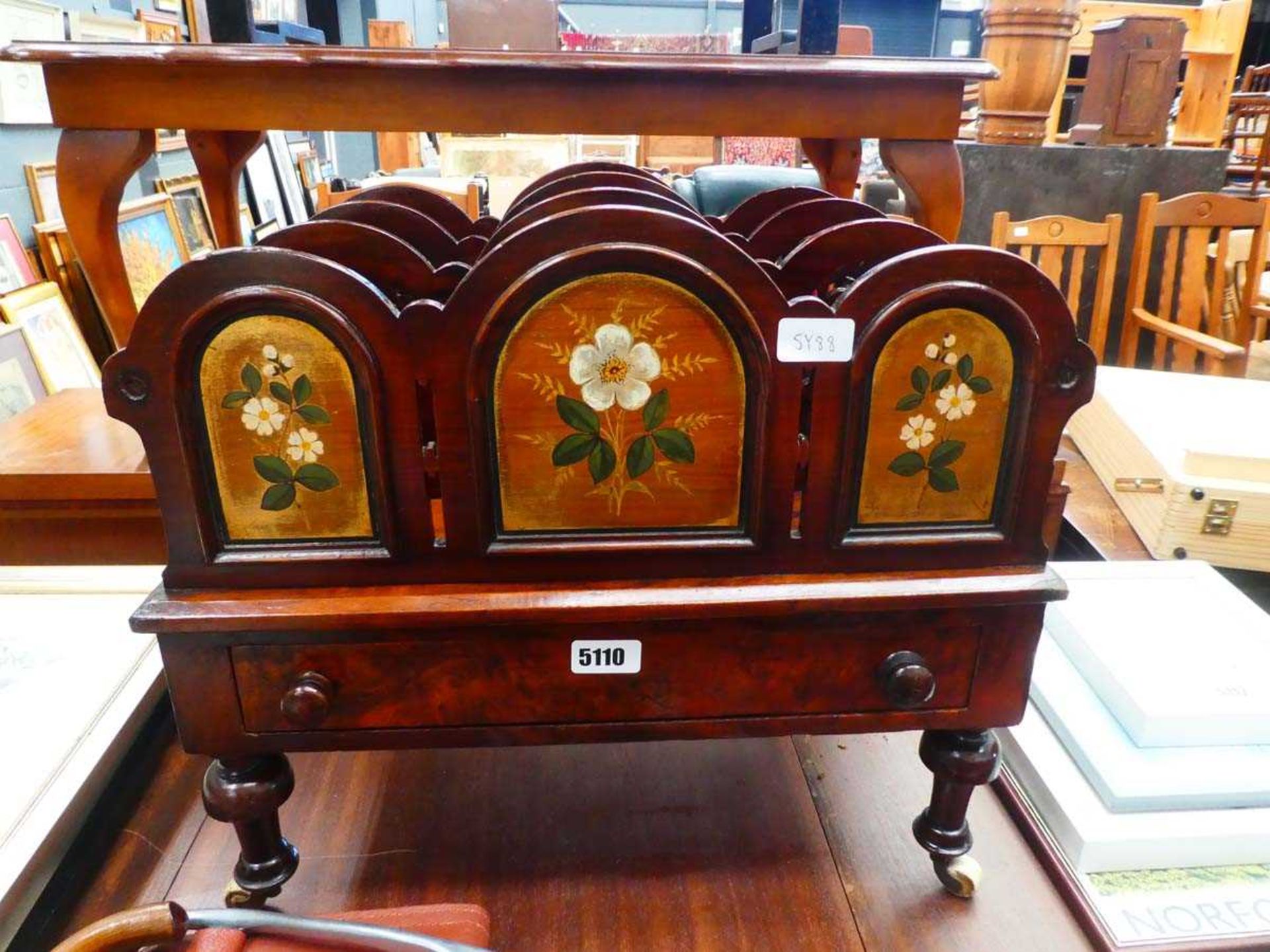 Floral decorated single drawer canterbury on ceramic wheels