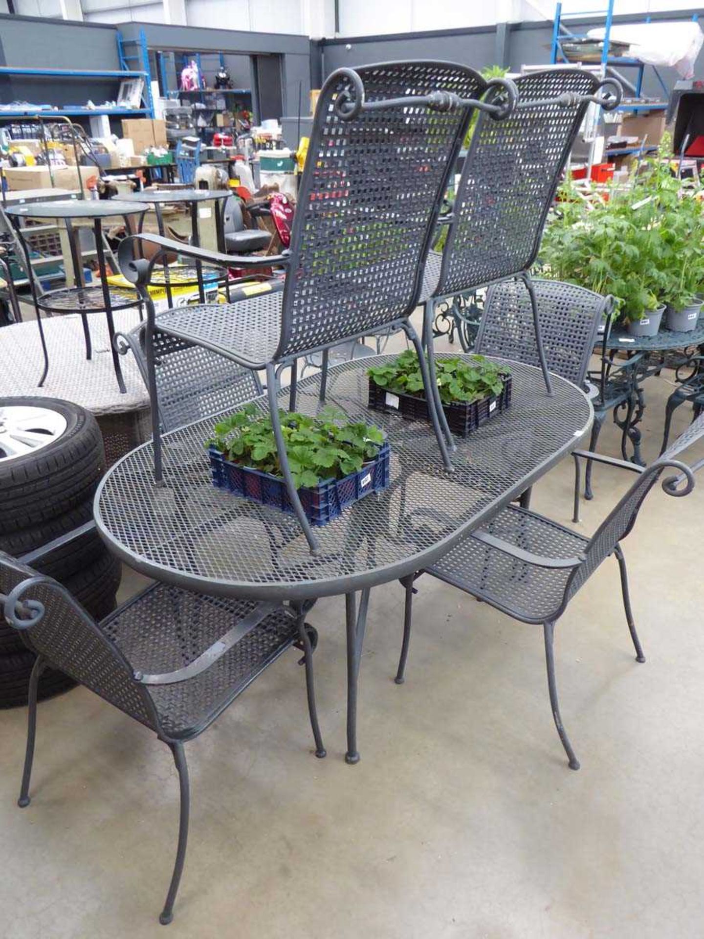 Oval grey metal garden table and 6 chairs