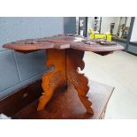 Carved Indian side table with folding tripod base