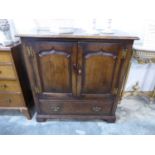 Dark oak cupboard with single drawer to base