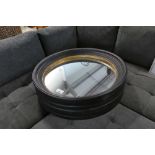 +VAT Boxed pair of black and gold framed circular wall mirrors, 95cm diameter