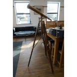 Brass telescope on tripod stand