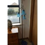 Floor standing brushed chrome triple branch lantern with blue glass patterned shades