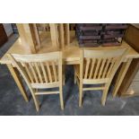 Modern rubber wood dining table with 4 matching panel seated dining chairs