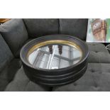 +VAT Pair of black and gold framed circular wall mirrors, 95cm diameter