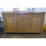 Modern light oak sideboard with 2 doors and 3 central drawers