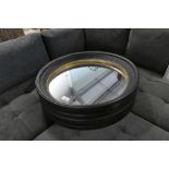 +VAT Boxed pair of black and gold framed circular wall mirrors, 95cm diameter