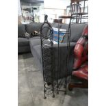 Pair of wrought metal free standing bottle racks