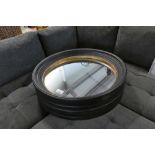 +VAT Boxed pair of black and gold framed circular wall mirrors, 95cm diameter