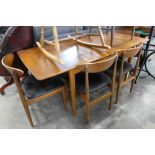 Mid century teak extending dining table with 4 matching black vinyl upholstered dining chairs *