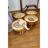 Four sets of 3 graduated brown and yellow plant pots