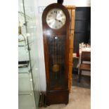 Dark oak cased grandfather clock with pendulum and weights