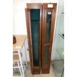 Pair of Edwardian freestanding dark oak gun cabinets with glazed doors