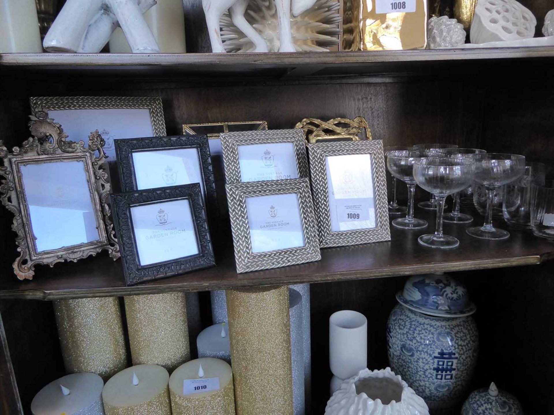 +VAT Shelf comprising small group of photo frames and glassware